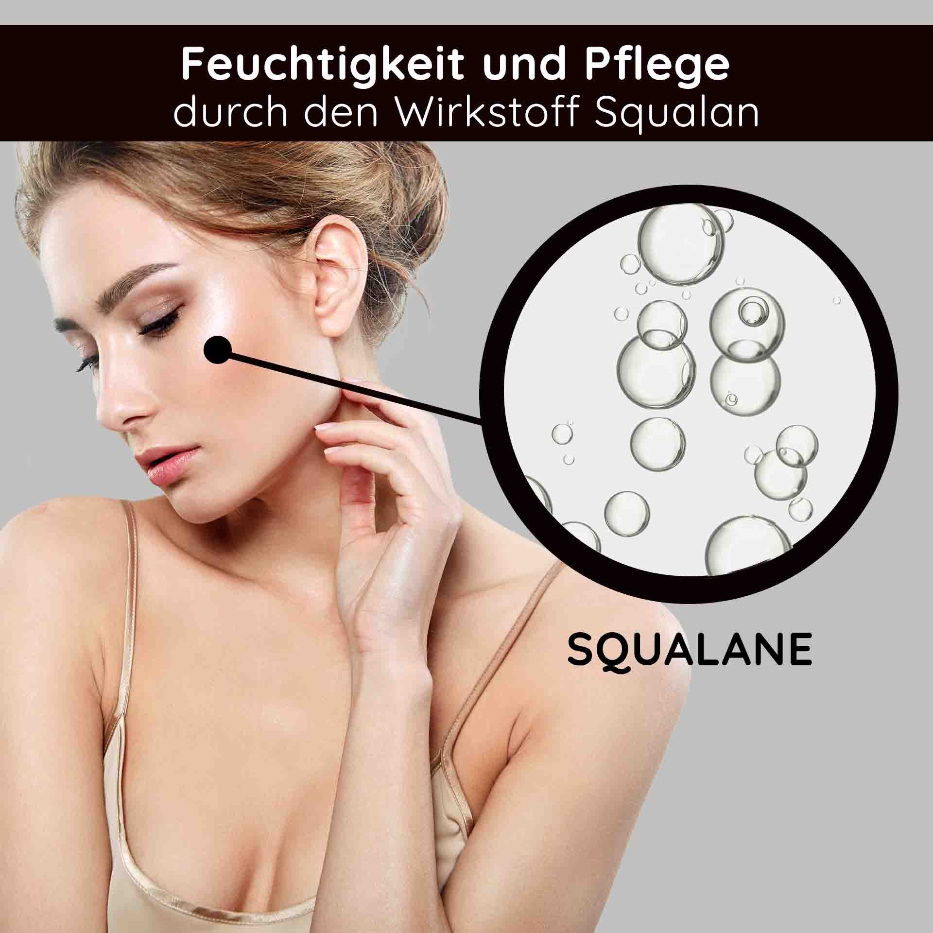 Hand trägt goldene Creme auf Gesichtshaut auf